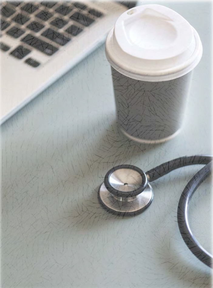 Laptop, coffee cup, and stethoscope