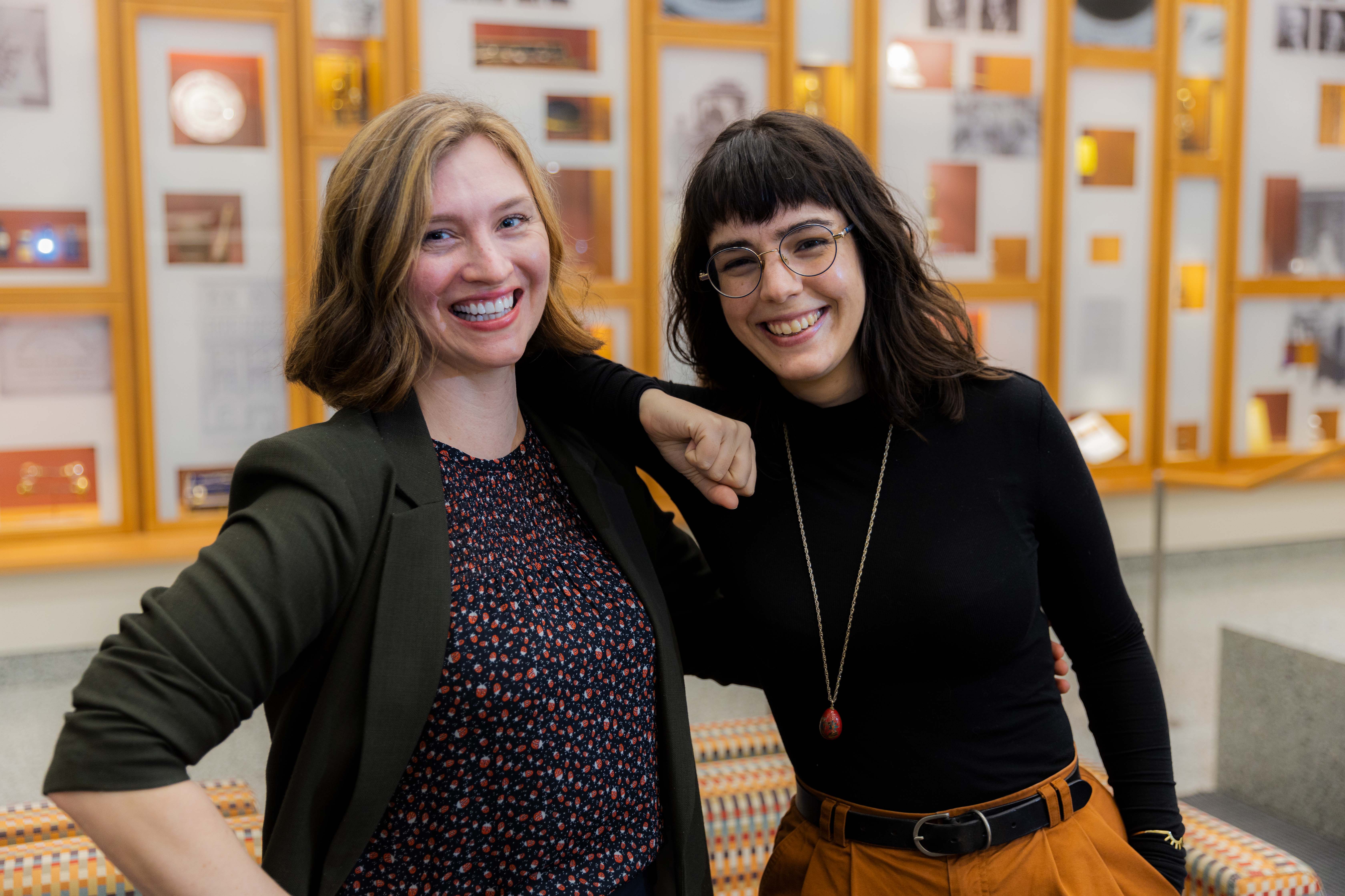 photo of Genevieve and Nicole leaning into each other and laughing