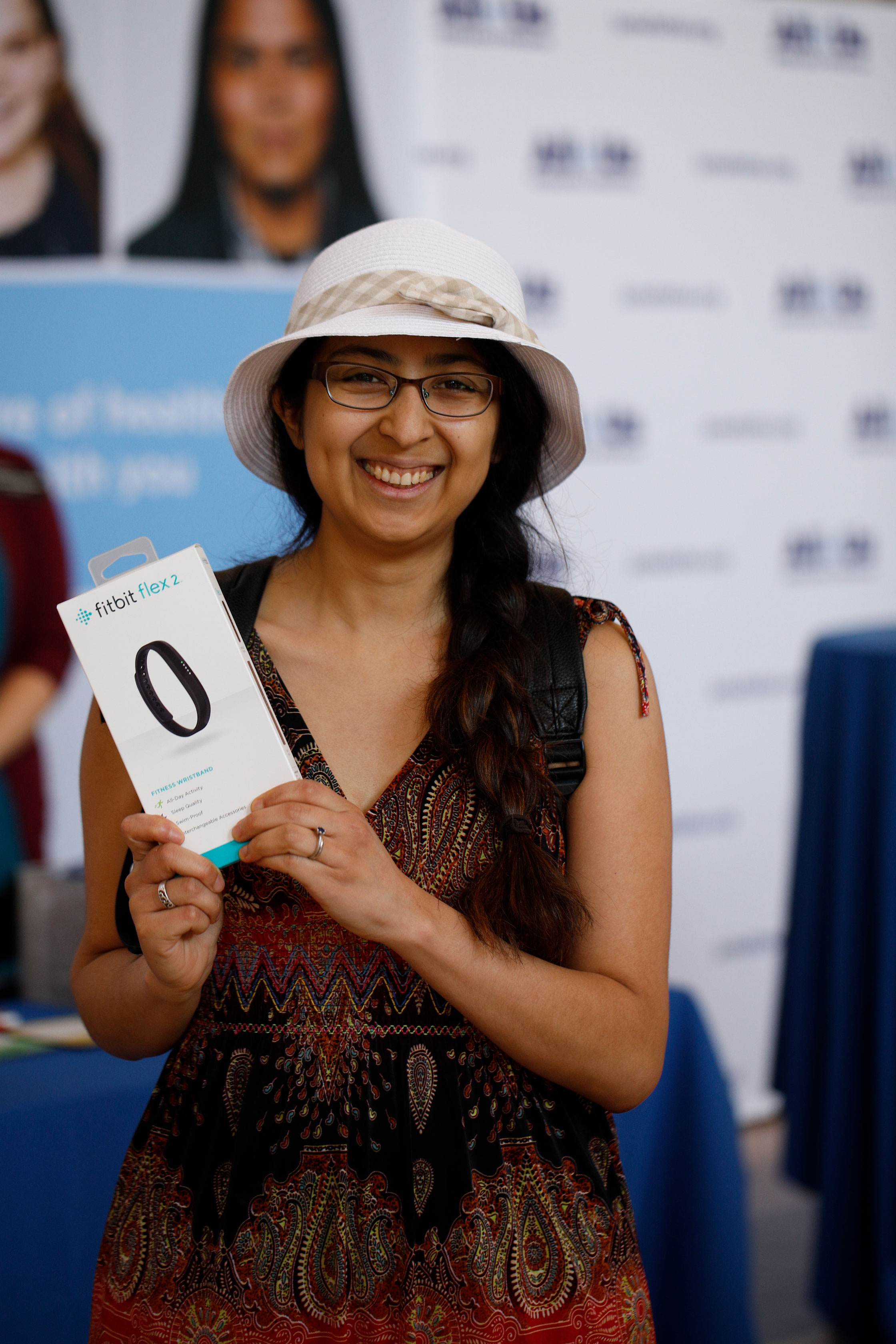 Woman holding a Fitbit box