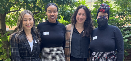 photo of interns smiling together at a conference